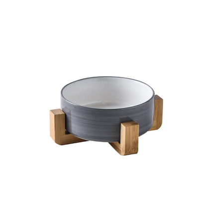Bol ceramic albastru cu relief in forma de labuta, pe suport din lemn
